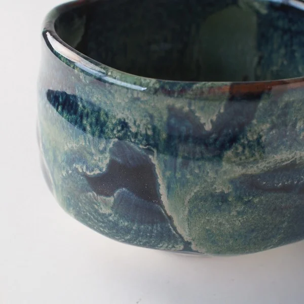 matcha tea bowl dark night close up