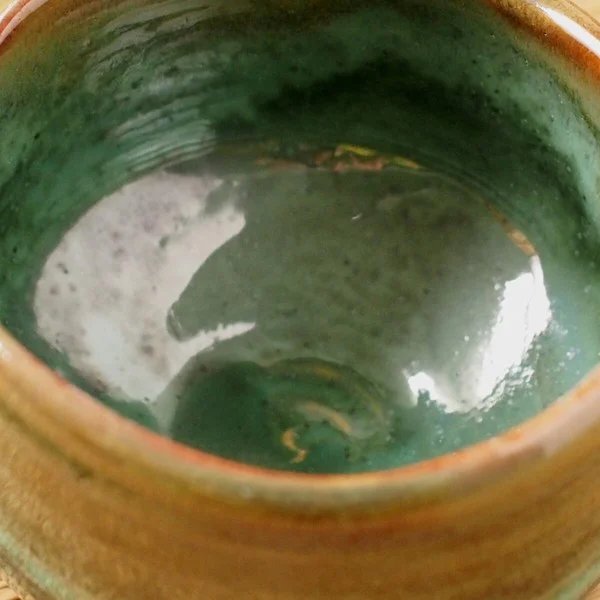 matcha tea bowl green top view close up