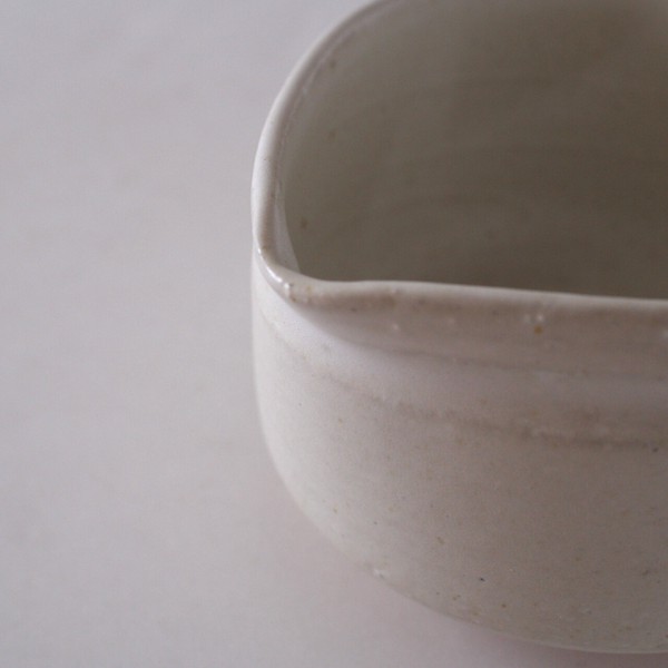 matcha tea bowl pottery wite angle view close up