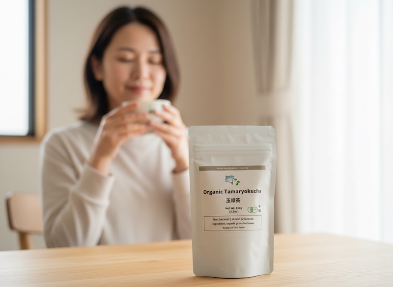 A woman with a calm expression enjoys the health benefits and mental clarity of Tamaryokucha tea
